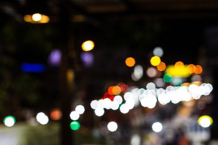 Blurred Defocused Lights of Heavy Traffic on a Wet Rainy City Road at Night - Commuting at Rush Hour Conceptの写真素材