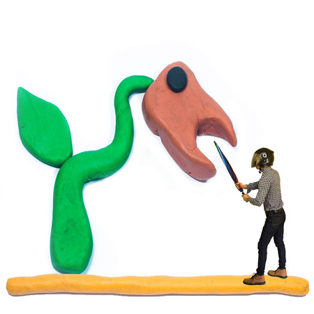 fighting warrior with fantasy carnivorous plantの写真素材
