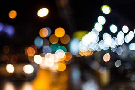 Blurred Defocused Lights of Heavy Traffic on a Wet Rainy City Road at Night .の写真素材