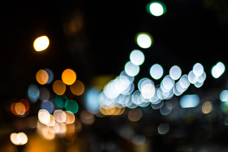 Blurred Defocused Lights of Heavy Traffic on a Wet Rainy City Road at Night .の写真素材