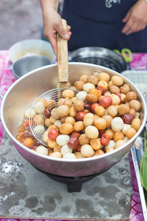 Meatballs frying in a pan.の写真素材