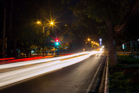 Long exposure photo of light trails on the street in Thailand.の写真素材