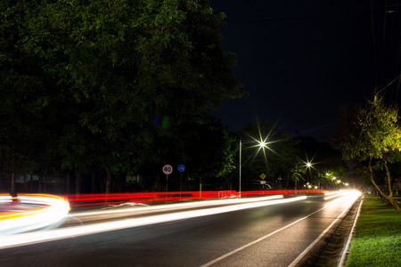 Long exposure photo of light trails on the street in Thailand.の写真素材