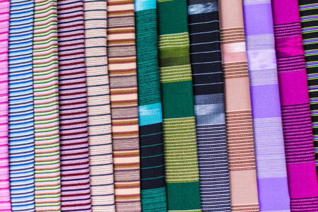 stack of traditional colourful sarong in the shop. for a background.の写真素材