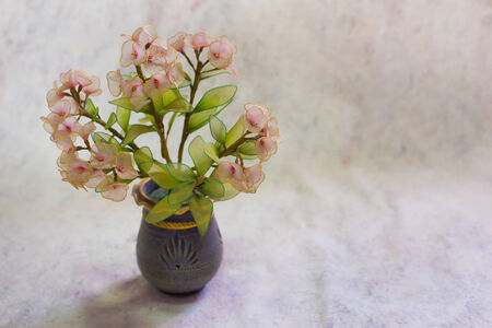 still life bogus flowers on painting background selected focus.の写真素材