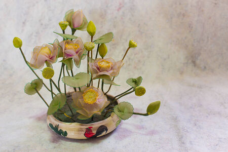 still life bogus flowers on painting background selected focus.の写真素材