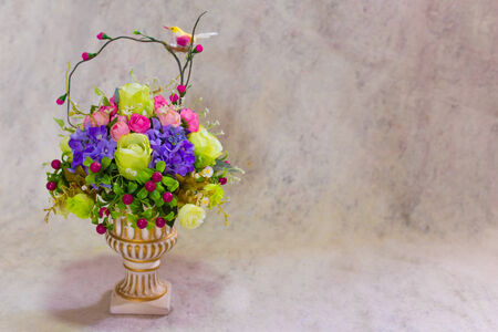 still life bogus flowers on painting background selected focus.の写真素材