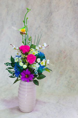 still life bogus flowers on painting background selected focus.の写真素材