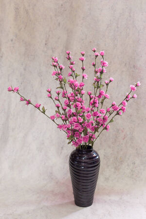 still life bogus flowers on painting background selected focus.の写真素材