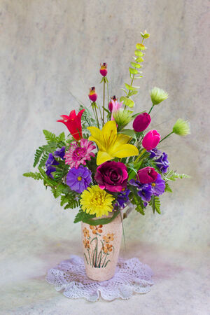 still life bogus flowers on painting background selected focus.の写真素材