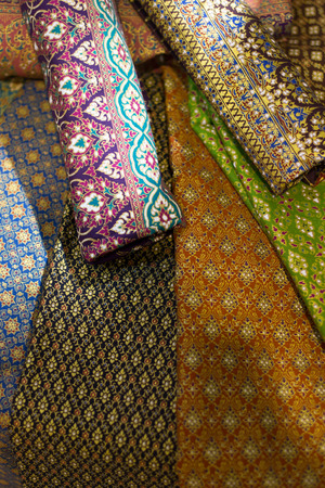 stack of traditional colourful sarong in the shop. for a background.の写真素材