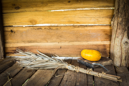 Still Life Leaves Broom With Papaya on Wooden Background.の写真素材
