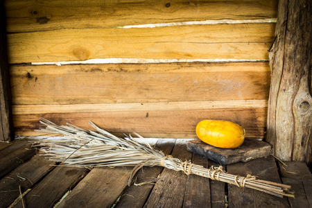 Still Life Leaves Broom With Papaya on Wooden Background.の写真素材