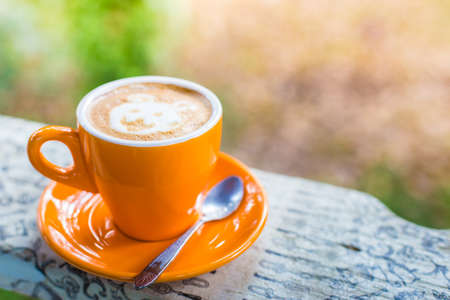 Coffee cup on wooden table - Vintage effect style pictures.の写真素材