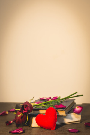 Roses on old books and small heart, vintage style.の写真素材