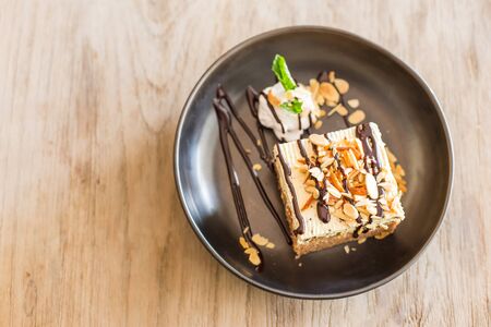 carrot cake with walnuts, prunes and dried apricots on a dark wood background. tinting. selective focusの写真素材