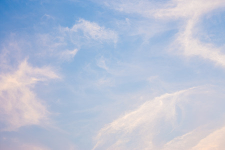 Blue and orange sky with clouds background.の写真素材