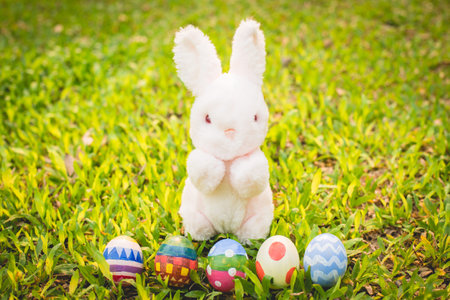 Sugar rabbit and easter eggs on meadow