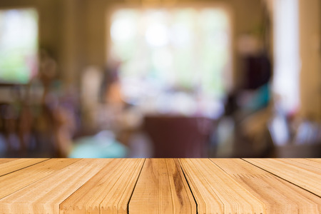 Selected focus empty brown wooden table and Coffee shop blur background with bokeh imageの写真素材