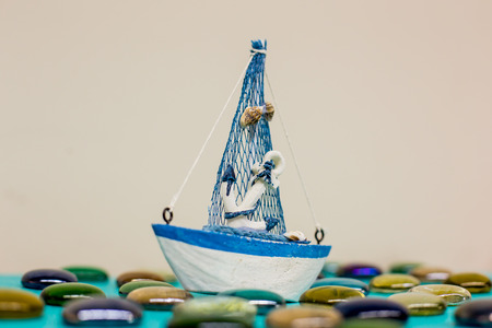 Hand made ceramic ship toys in the sea for summer concept.の写真素材