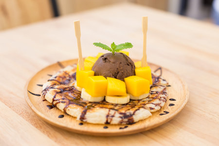 Chocolate ice cream on mango rotiの写真素材
