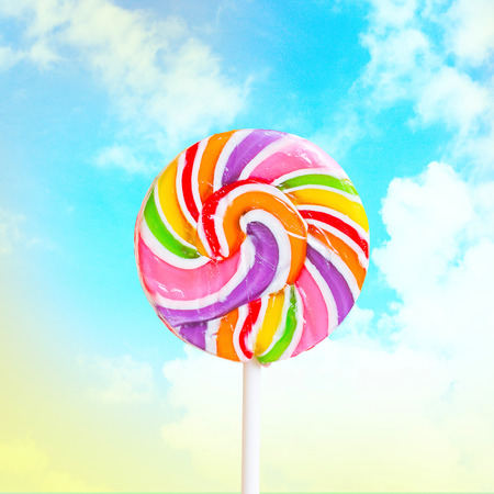 Lollipop on vintage and retro sky background.の写真素材