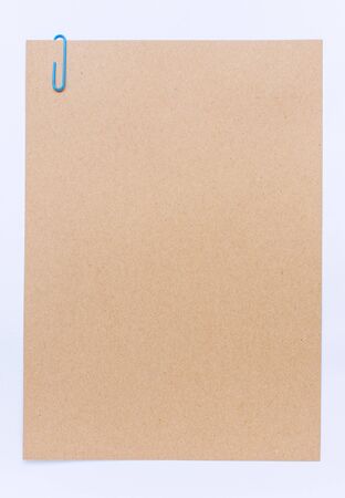 Brown sheet of paper for notes and paper clipの写真素材