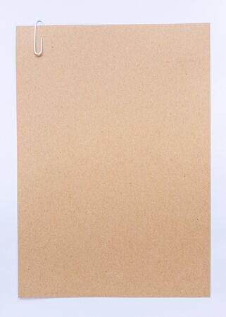 Brown sheet of paper for notes and paper clipの写真素材