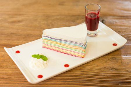 Rainbow crape cake on plateの写真素材