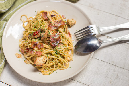 Fusion food - Spicy spaghetti with bacon and basil.の写真素材