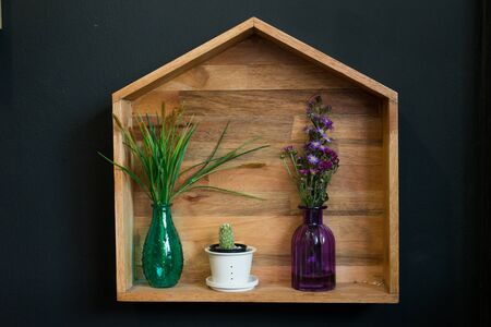 flowers arranged in the corner of a wooden box.の写真素材
