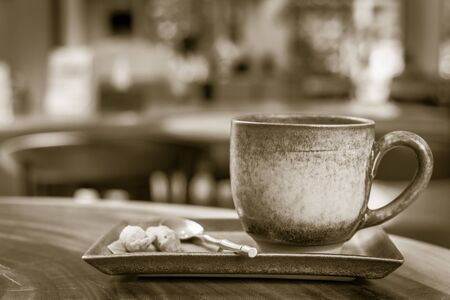 hot latte art coffee on wooden table, vintage and retro styleの写真素材