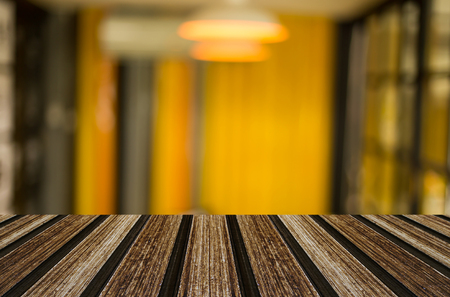 Selected focus empty brown wooden table and Coffee shop blur background with bokeh image, for product display montage.の写真素材