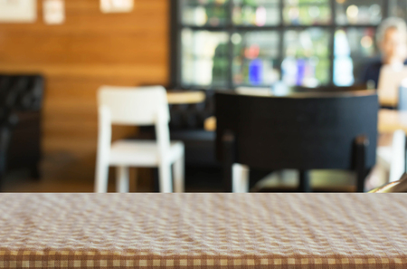 Checkered table cloth on empty table for Your photomontage or product display.の写真素材