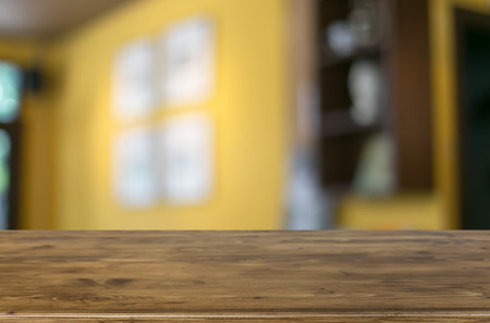 Selected focus empty brown wooden table and Coffee shop blur background with bokeh image, for...