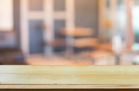 Selected focus empty brown wooden table and Coffee shop blur background with bokeh image, for...