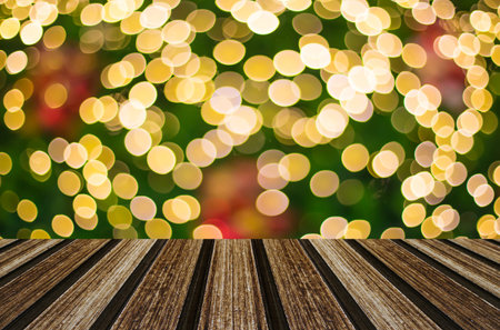 Christmas holiday background with empty wooden deck table over festive bokeh. Ready for product...