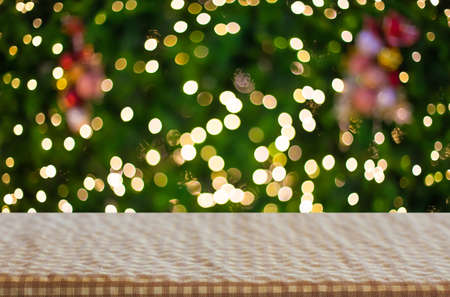 Christmas holiday background with empty wooden deck table over festive bokeh. Ready for product montage.の写真素材