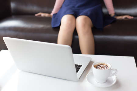 Young asian business woman using laptop outdoors.の写真素材
