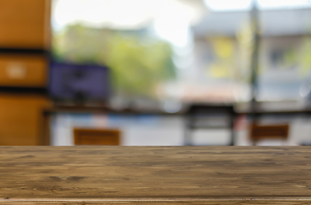 Selected focus empty brown wooden table and Coffee shop blur background with bokeh image, for product display montageの写真素材