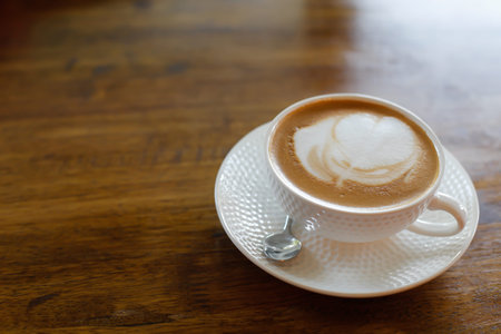 Hot art Latte Coffee in the table.