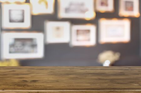 Selected focus empty brown wooden table and Coffee shop blur background with bokeh image, for product display montageの写真素材