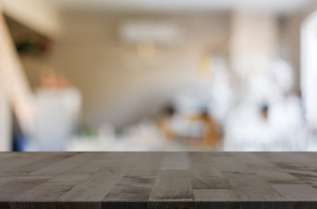 Selected focus empty brown wooden table and Coffee shop blur background with bokeh image, for...