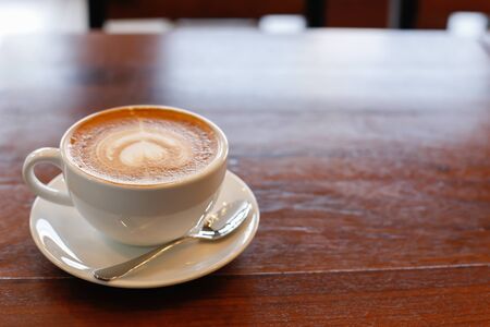 Hot art Latte Coffee in the table.の写真素材