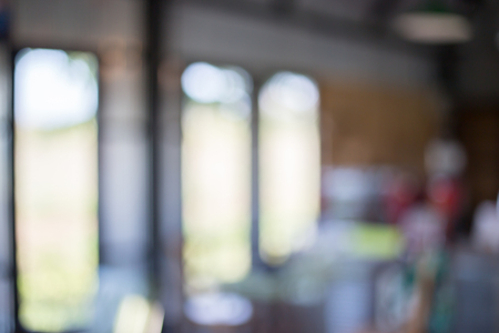 Blurred background : Coffee shop restaurant blur background with bokeh light.の写真素材