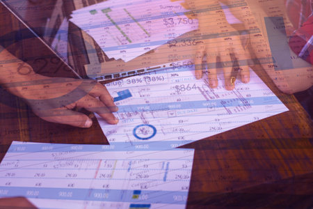 business documents on office table and graph business with social network diagram and man working in...