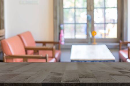 Selected focus empty brown wooden table and Coffee shop blur background with bokeh image, for product display montage.の写真素材
