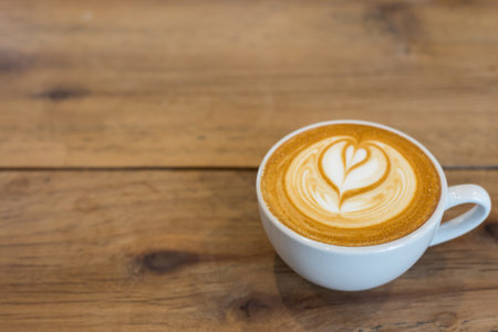 Hot art Latte Coffee on the tableの写真素材