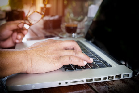 Close-up of typing male hands.の写真素材