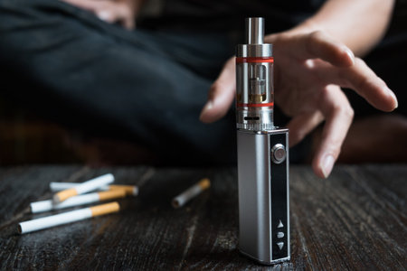 Close-up Of Person Hand Holding Electronic Cigarette.